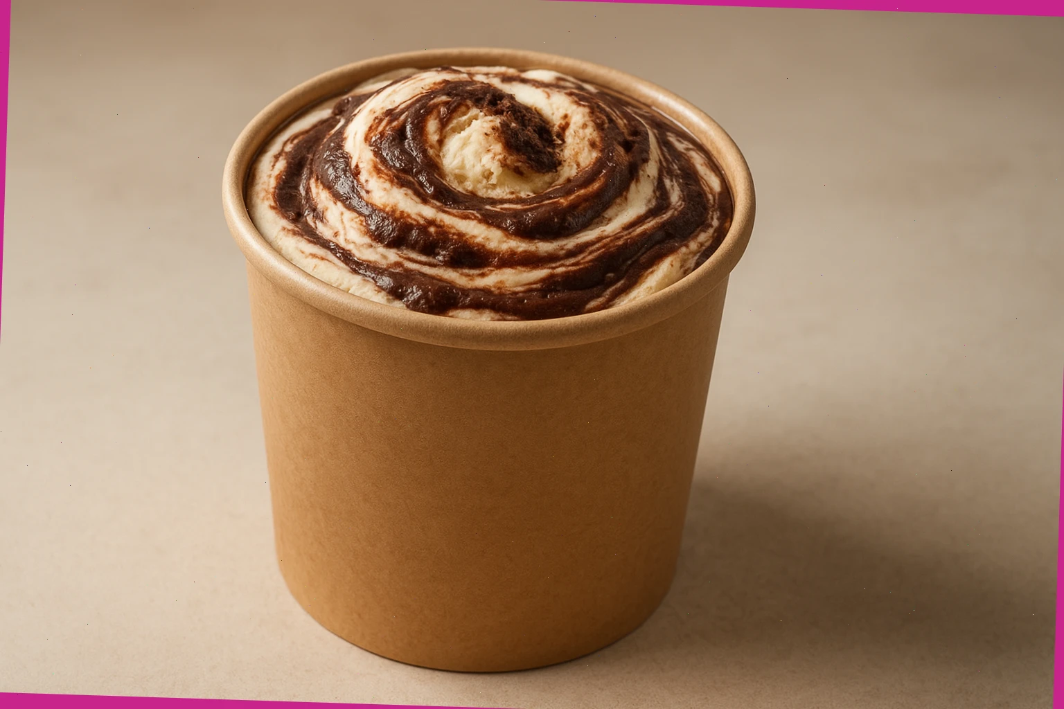 Chocolate ripple ice cream with swirls visible through the paper pot
